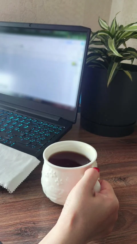 Woman Placing Cup on Desk While Working from Home Stock Footage 337025680
