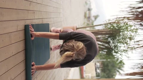 A woman in a plank doing exercises on the abs in the park. Stock Footage 226937346