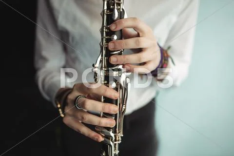 Woman Playing A Clarinet In Music School