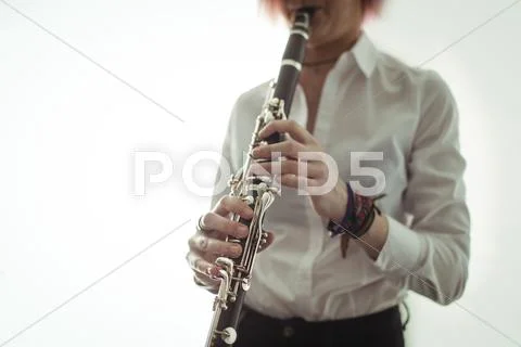 Woman Playing A Clarinet In Music School