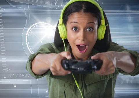 Woman playing with computer game controller with motion background Stock Photos