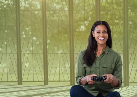 Woman playing with computer game controller with nature background Stock Photos