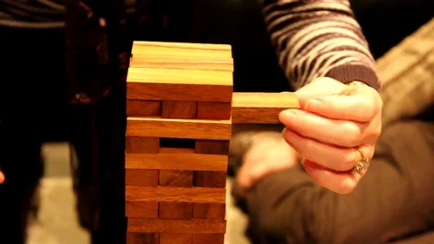 Woman playing a constructor game Stock Footage 77864145