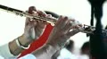 A woman playing on flute HD Footage
