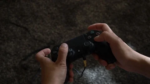 Woman playing on game controller Stock Footage 94759702