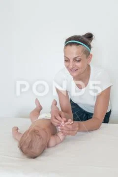 A woman playing with a small child. Pastime. Leisure with children Stock Photos