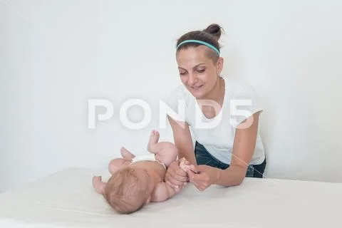 A woman playing with a small child. Pastime. Leisure with children Stock Photos