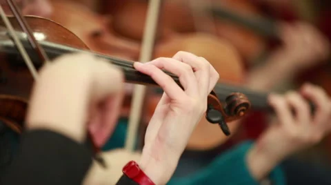 Woman playing the violin. Bowed string instrument in the orchestra. Stock Footage 46743343