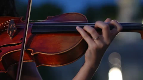 Woman playing the violin during a classical concert at night Stock Footage 341464298