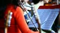 A woman playing on violin HD Footage