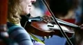 A woman playing on violin HD Footage