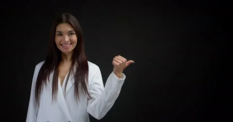 Woman pointing to an empty space for your advertising content. Stock Footage 170196824