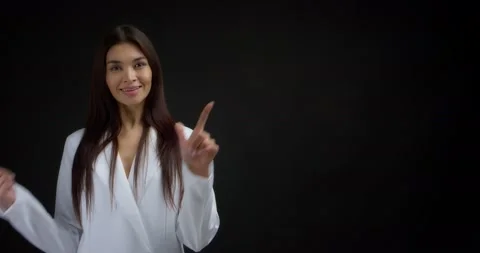 Woman pointing to an empty space for your advertising content. Stock Footage 170196970