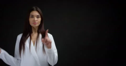 Woman pointing to an empty space for your advertising content. Stock Footage 170197024