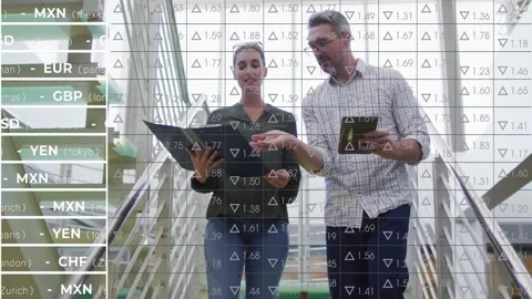 Woman pointing folder and man tapping tablet while descending stairs, market Stock Footage 331701048