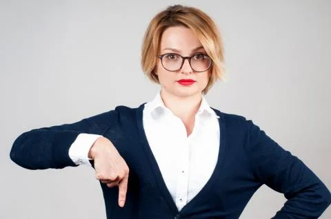 Woman is pointing at a subscription button down Below Stock Photos