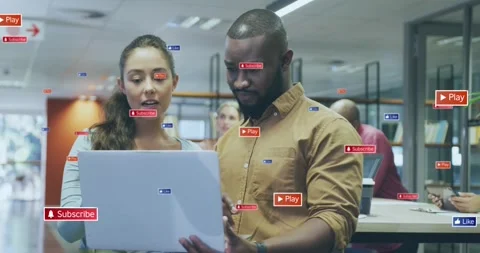 Woman pointing while man tapping laptop touchpad animated icons growing around Stock Footage 326974725