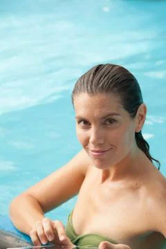 Woman on the pool using the tablet Foto stock