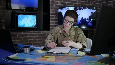 Woman portrait soldier in glasses and uniform, working with Stock Footage