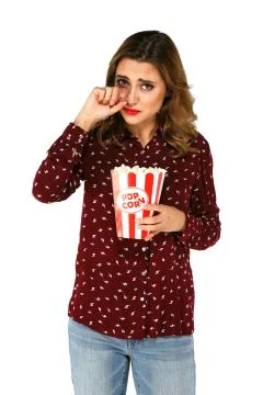 Woman posing and crying while holding popcorn Stock Photos