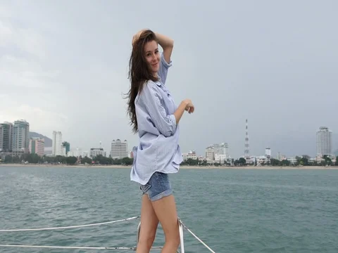 Woman posing and looking at camera on yacht Stock Footage 79767917