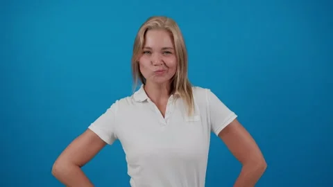 Woman posing making funny faces on blue background Stock Footage 288120181
