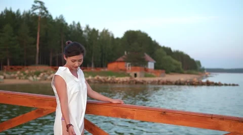 Woman posing on pier at sunset Video stock 68963827