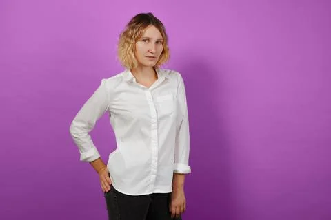 Woman posing in studio on pink solid background Stock Photos