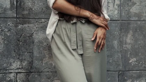 Woman posing by the wall. Stock Footage 90456838