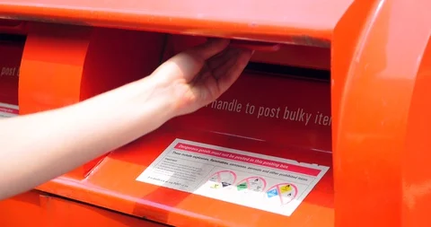 Woman posts postcard in australian authentic postbox Видео 129316862