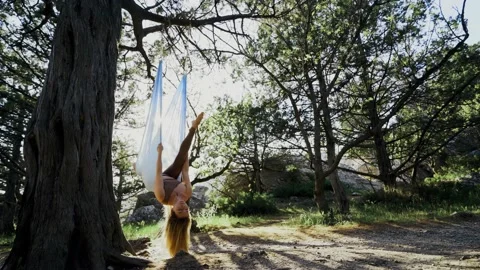 Woman practice upside-down exercise on rope Stock Footage 196979213