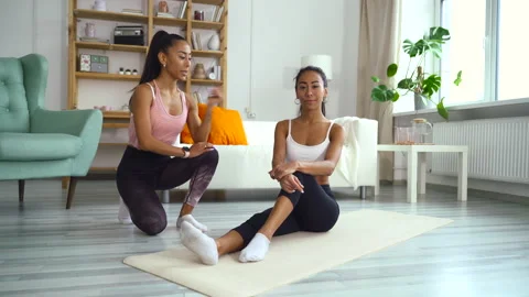 Woman practice yoga exercise for flexibility, sit stretch warm up on map with Stock Footage 158985139