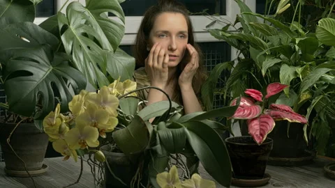 A woman practicing EFT in a winter garden. Stock Footage 277539061