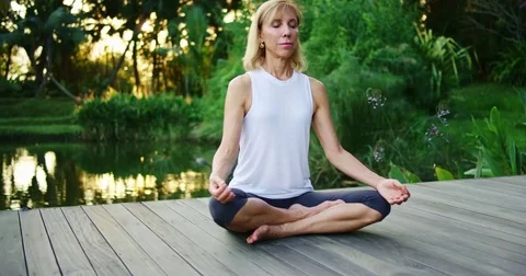 Woman Practicing Meditation Stock Footage 70253417