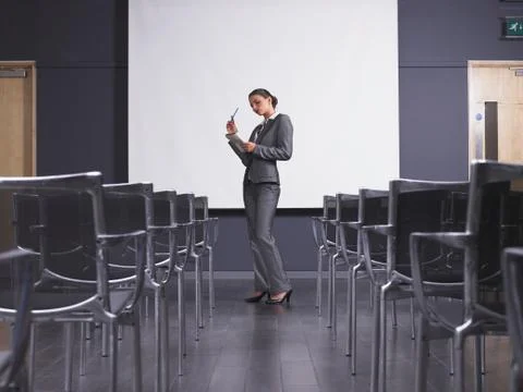 Woman practicing speech in empty presentation room Foto stock