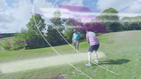 Woman practicing swing and walking with partner, purple overlays showing swing Video stock 333595137