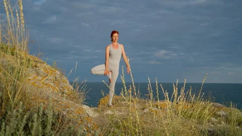 Woman Practicing Yoga Tree Pose Outdoors Video stock 312503757