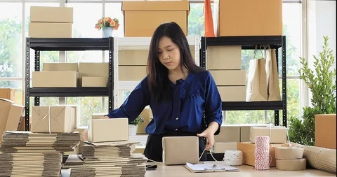 Woman prepare parcel post for send to customer. Stock Footage 100872880