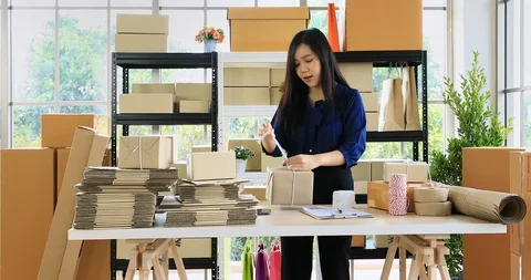 Woman prepare parcel post for send to customer. Stock Footage 101092169