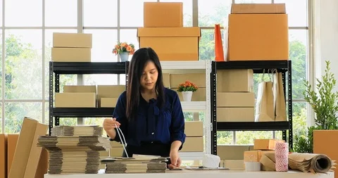 Woman prepare parcel post for send to customer. Stock Footage 101269193