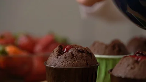 A woman prepares delicious cupcakes in the kitchen Stock Footage