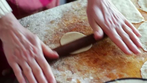 Woman prepares meat pies, working with the dough and filling, close-up Stock Footage