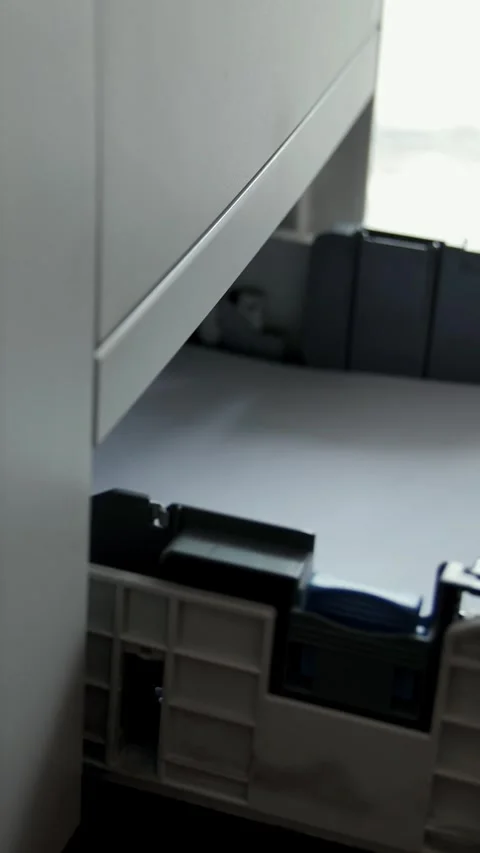 A woman prepares a printer for printing documents. Stock Footage 318642361