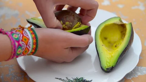 Woman preparing avocado 스톡 동영상 70833307
