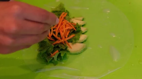 Woman Preparing Avocado Spring Roll Carrots Wrap Asian Cuisine Thai Food Korean  Stock Footage 79243603