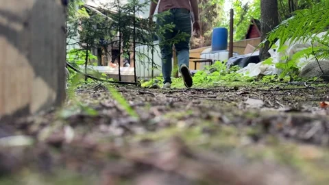 Woman Preparing Backyard Outdoor Space for DIY Fall Makeover Video stock 342629997