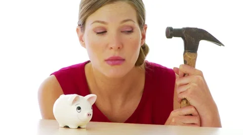 Woman preparing to break into her piggy bank Stock Footage