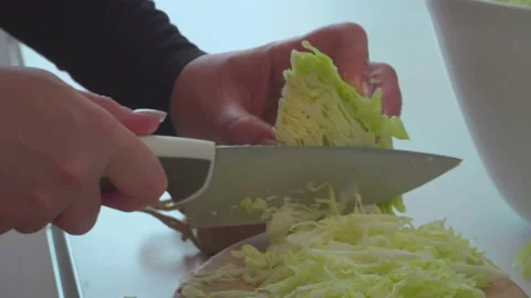 Woman preparing cabbage salad Stock Footage 145333387