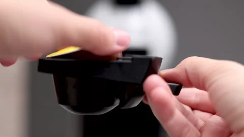 Woman preparing coffee using capsules in machine at home Stock Footage 247173124