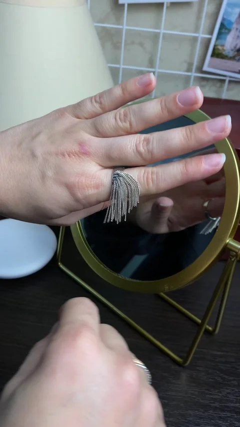 Woman preparing for date do make up put ring on her finger Stock Footage 252881375